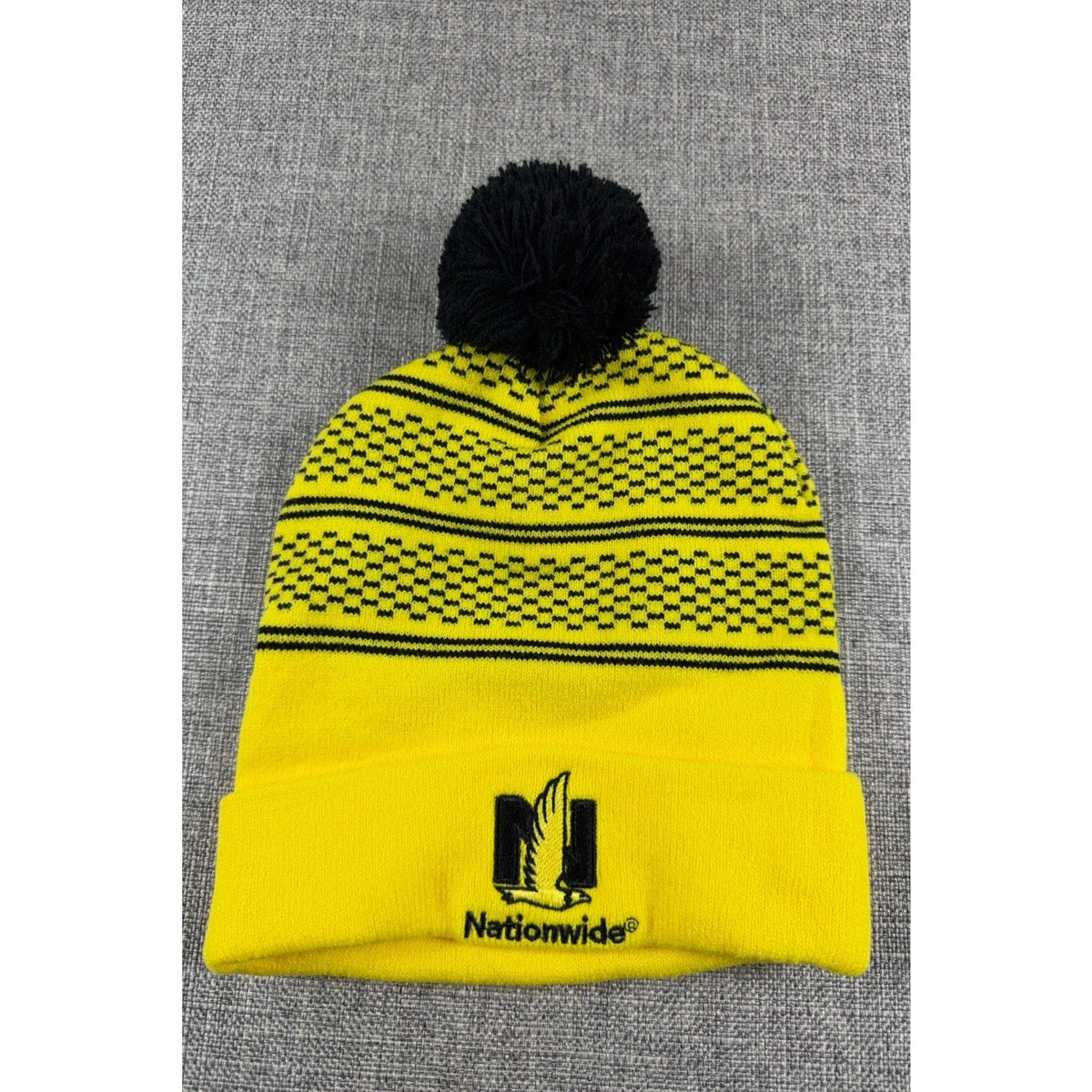 Second Half Supply Co, LLC Columbus Crew yellow and black knit pom beanie with Nationwide logo on the cuff