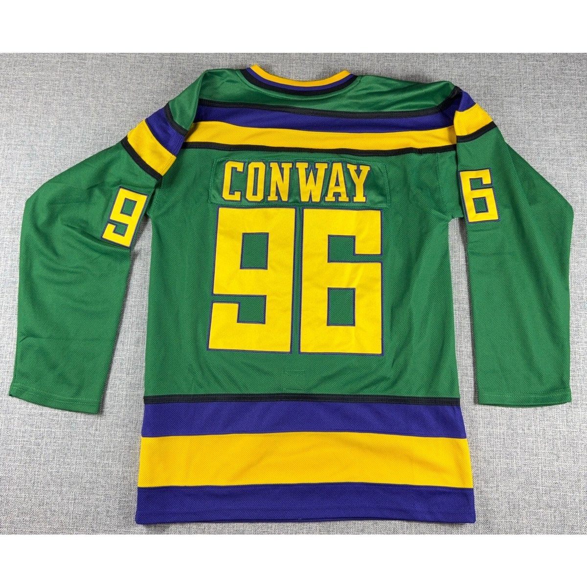 Second Half Supply Co, LLC green Charlie Conway #96 Mighty Ducks hockey jersey with yellow and purple back graphics