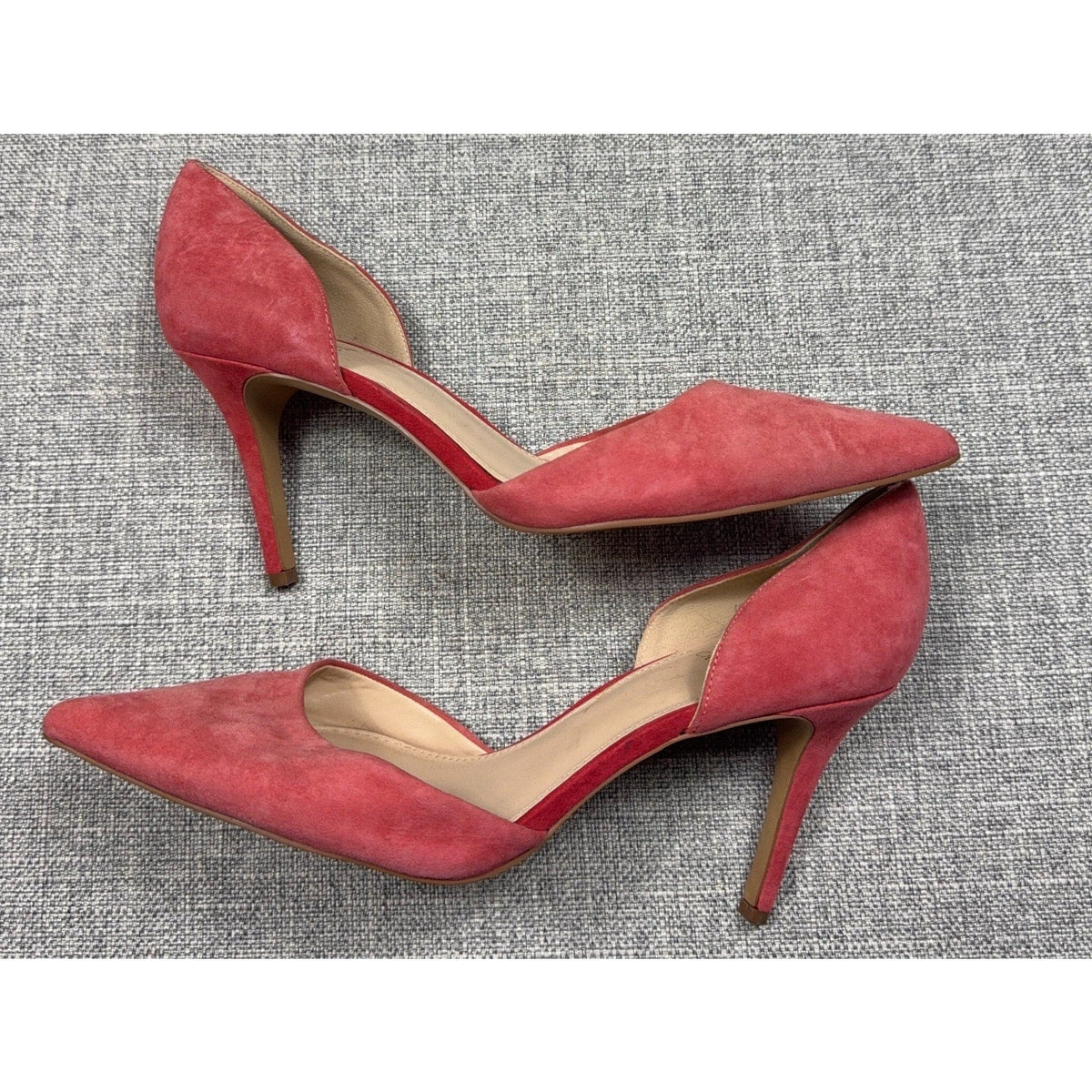 Second Half Supply Co, LLC coral pink suede d'Orsay pumps with pointed toes and slim stiletto heels.