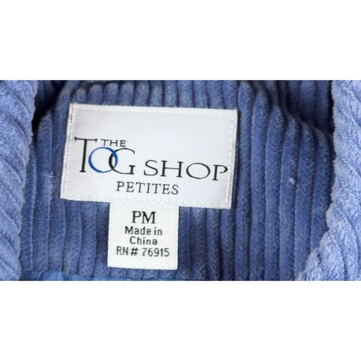Second Half Supply Co, LLC label inside a blue wide-wale corduroy jacket from The Tog Shop Petites in size PM
