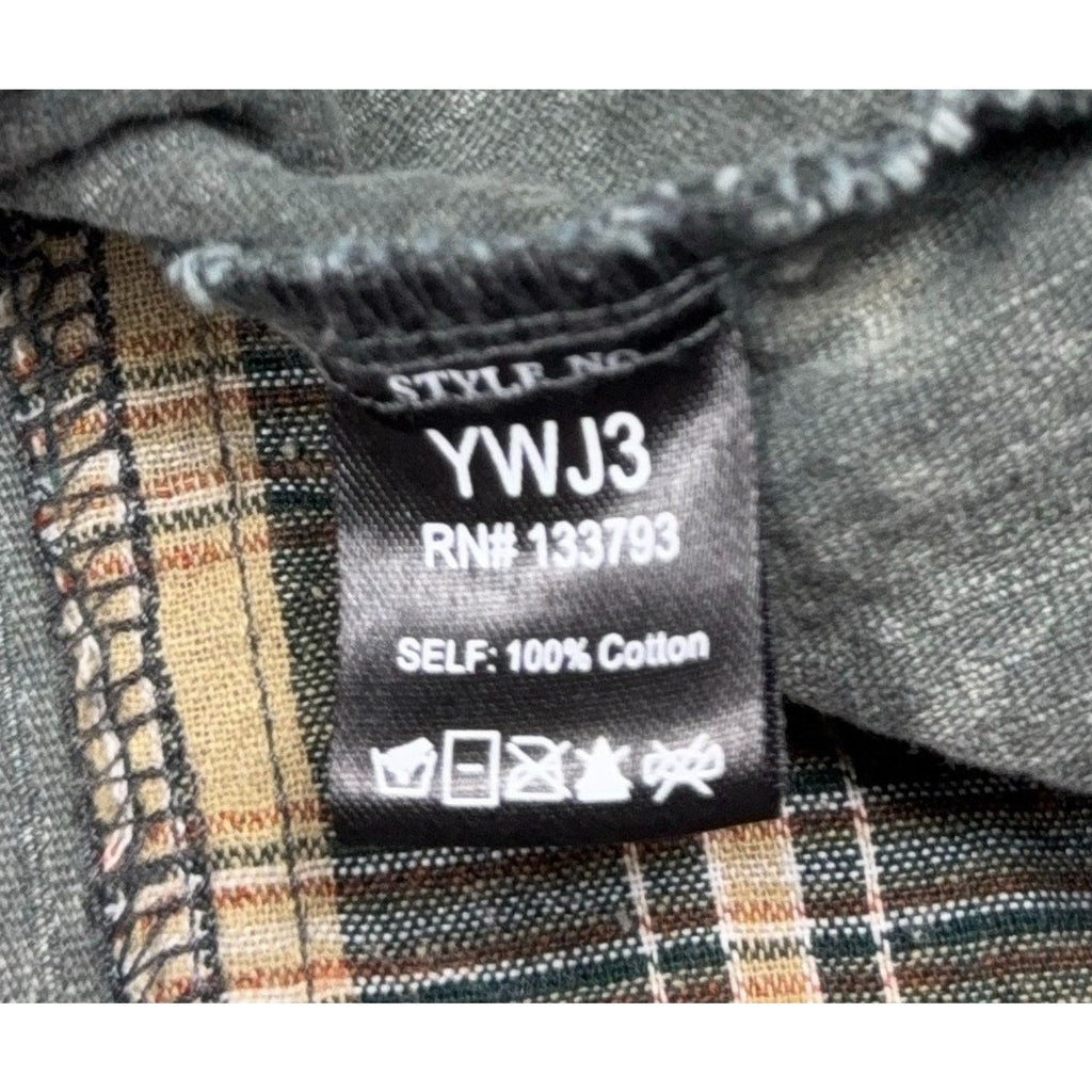 Second Half Supply Co, LLC clothing tag showing style YWJ3 and 100% cotton material on a plaid corduroy shacket