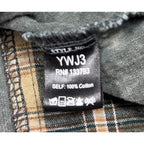 Second Half Supply Co, LLC clothing tag showing style YWJ3 and 100% cotton material on a plaid corduroy shacket