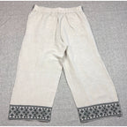 Second Half Supply Co, LLC cream wide-leg cropped pants with black geometric embroidery on the hem and elastic waist
