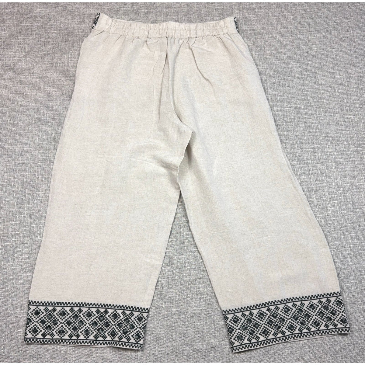Second Half Supply Co, LLC cream wide-leg cropped pants with black geometric embroidery on the hem and elastic waist