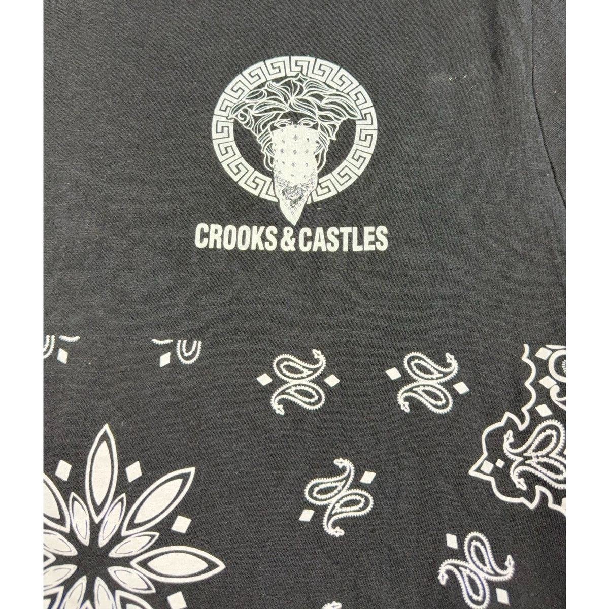Second Half Supply Co, LLC black cotton t-shirt featuring a white Medusa graphic and paisley bandana print detail.