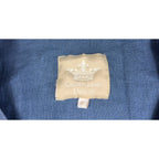Second Half Supply Co, LLC Crown Linen Designs brand label on a textured muted denim blue fabric garment