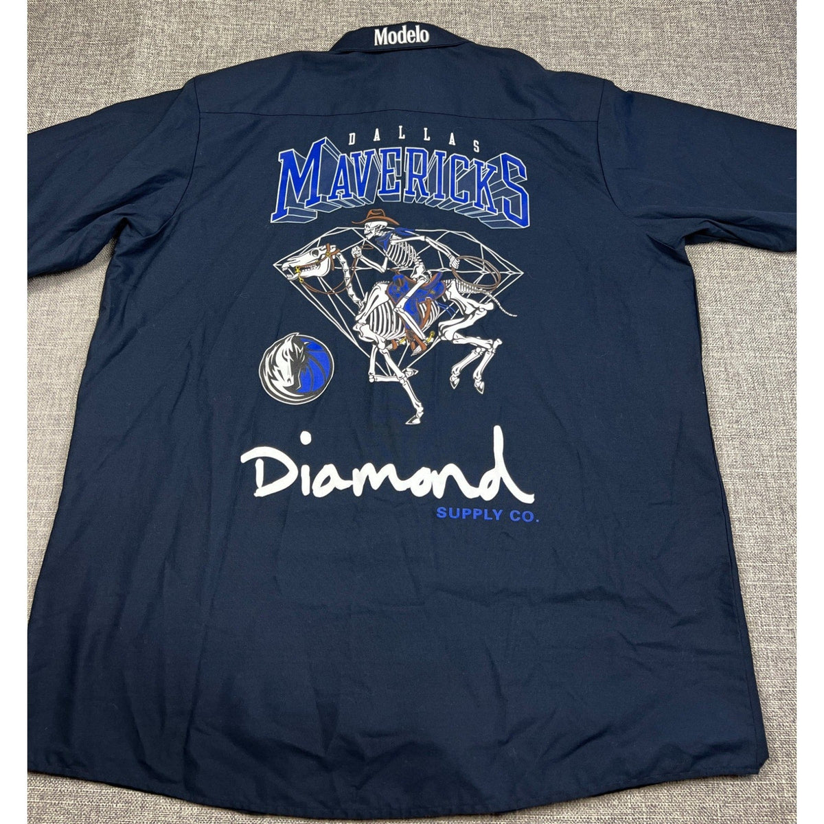 Second Half Supply Co, LLC navy blue Diamond Supply x Modelo x Dallas Mavericks button-up shirt with skeleton graphic