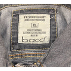 Second Half Supply Co, LLC denim jacket interior label showing size XL and Bacci brand name on faded blue denim