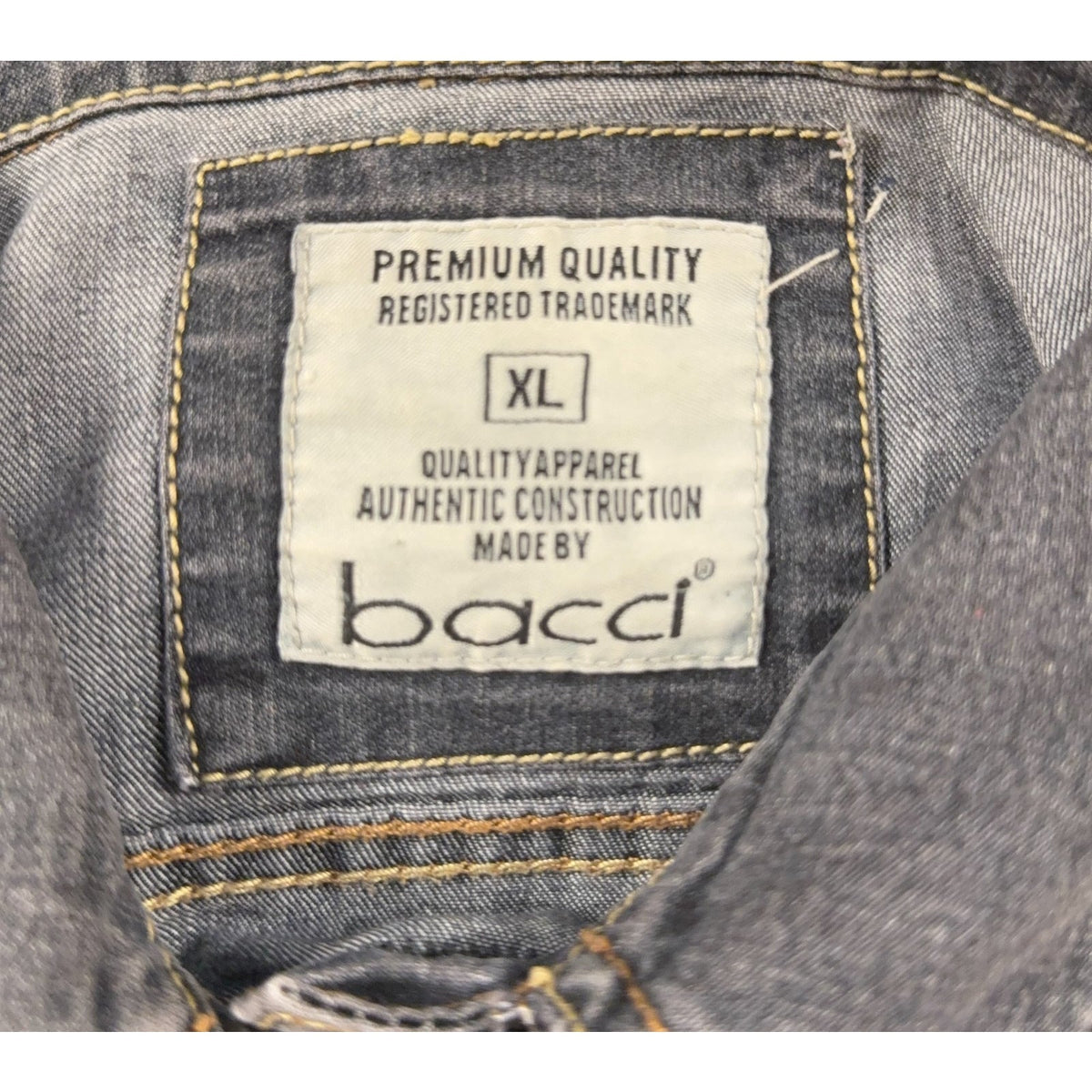 Second Half Supply Co, LLC denim jacket interior label showing size XL and Bacci brand name on faded blue denim