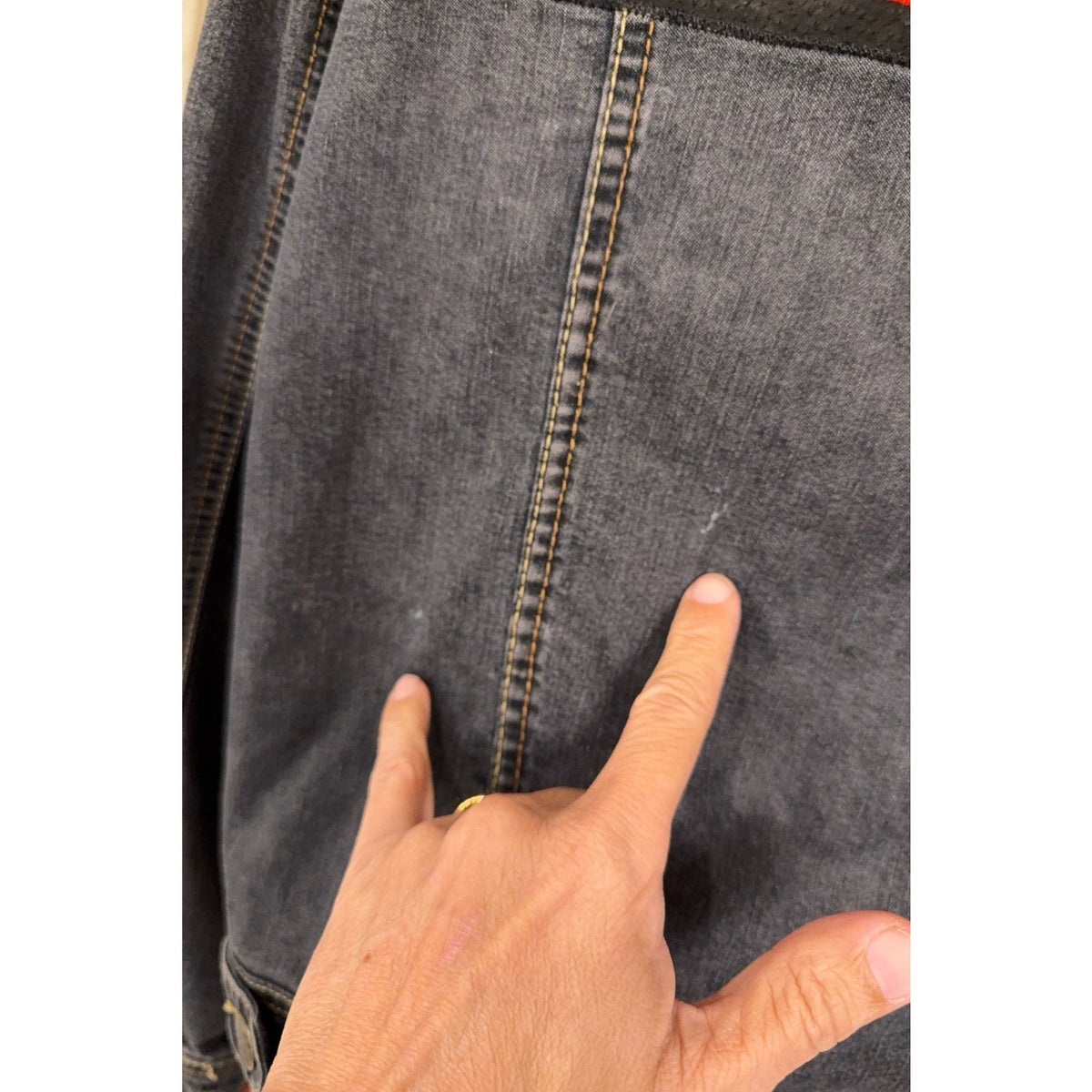 Second Half Supply Co, LLC denim jacket showing a small light mark on the faded black fabric near the seam