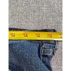 Second Half Supply Co, LLC blue stretch denim jeans waist measurement with yellow tape measure