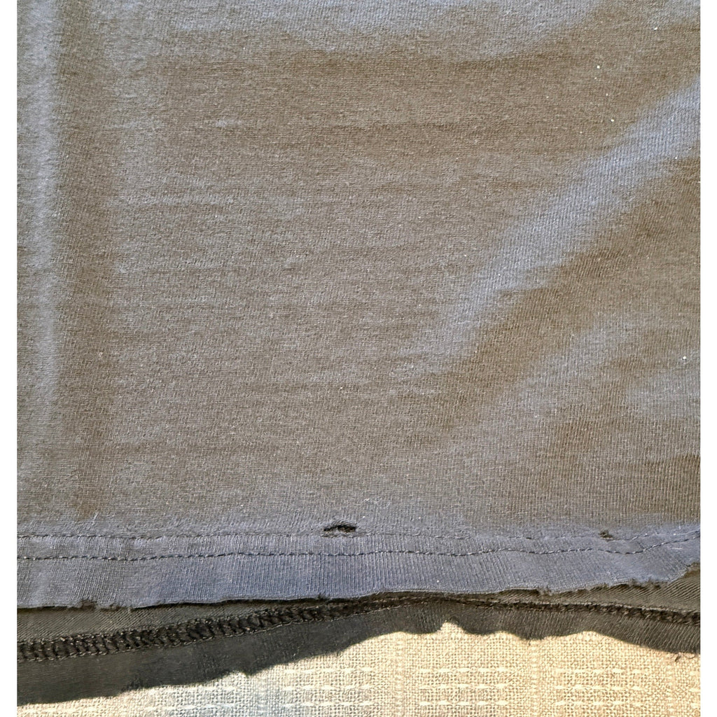 Second Half Supply Co, LLC vintage black cotton t-shirt hem showing intentional distressing and small holes
