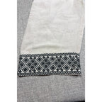 Second Half Supply Co, LLC cream wide-leg pants featuring intricate black geometric embroidery on the cropped hem