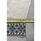 Second Half Supply Co, LLC cream wide leg pants with black geometric embroidery on the hem measured with a tape