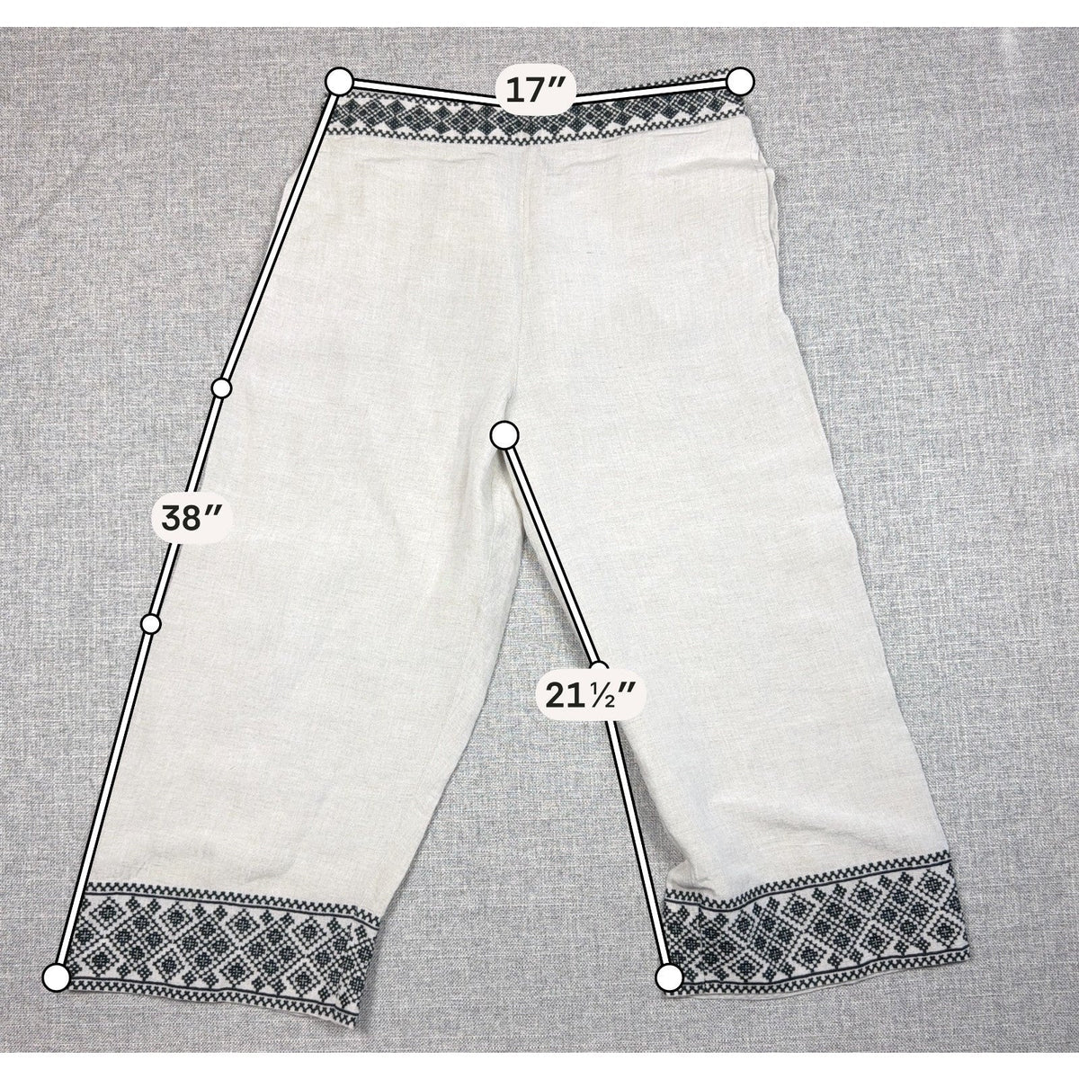 Second Half Supply Co, LLC cream wide-leg cropped pants with black geometric embroidery on waist and hem
