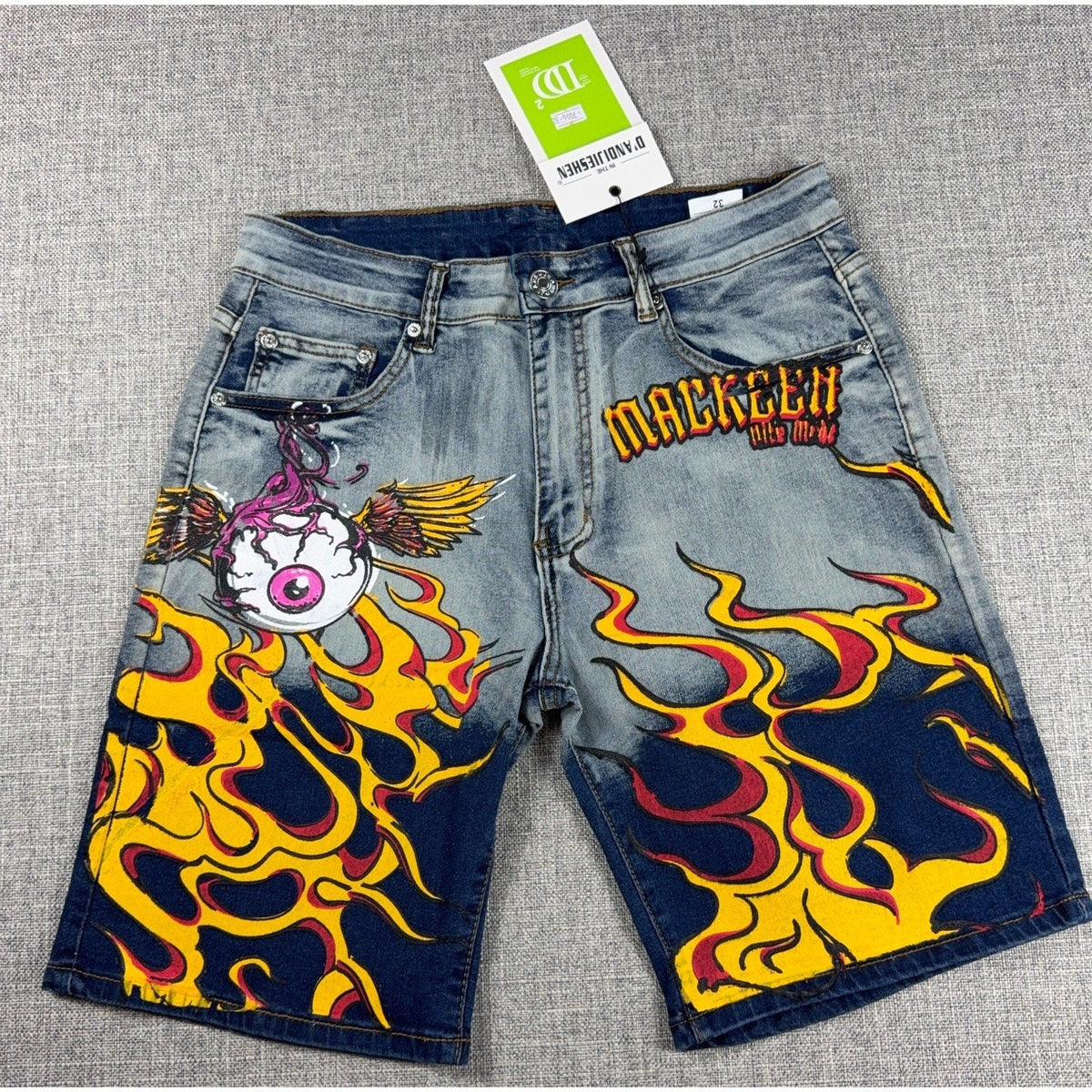Second Half Supply Co, LLC D'Andijieshen light-wash denim shorts with yellow flame and winged eyeball graphic print.