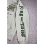 Second Half Supply Co, LLC sage green Frog and Toad pullover hoodie with graphic sleeve print and chest illustration.