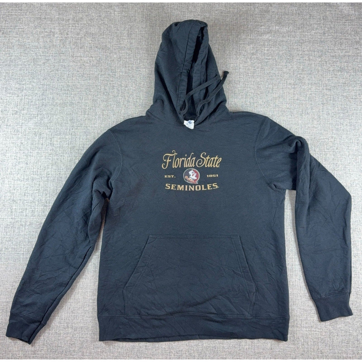 Second Half Supply Co, LLC faded black Florida State Seminoles hoodie with vintage graphic and kangaroo pocket.