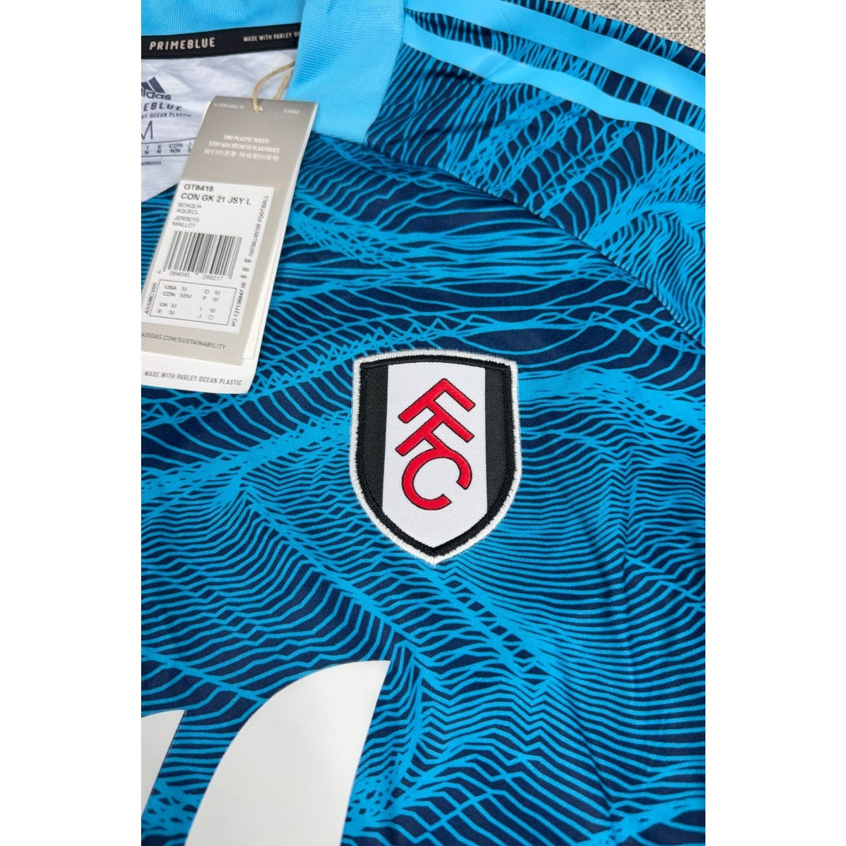 Second Half Supply Co, LLC Fulham FC goalkeeper jersey in aqua and navy with Condivo 21 graphic and team crest