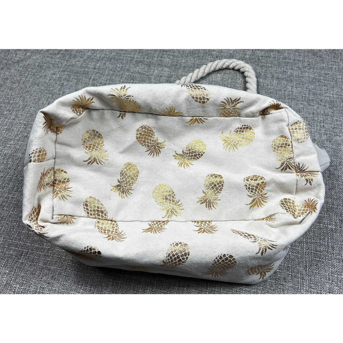 Second Half Supply Co, LLC cream canvas beach tote bag with metallic gold pineapple print and twisted rope handles