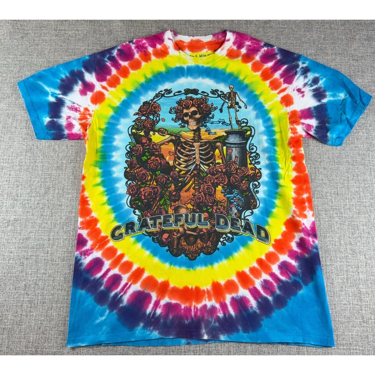Second Half Supply Co, LLC Liquid Blue Grateful Dead tie-dye t-shirt with skeleton and roses graphic