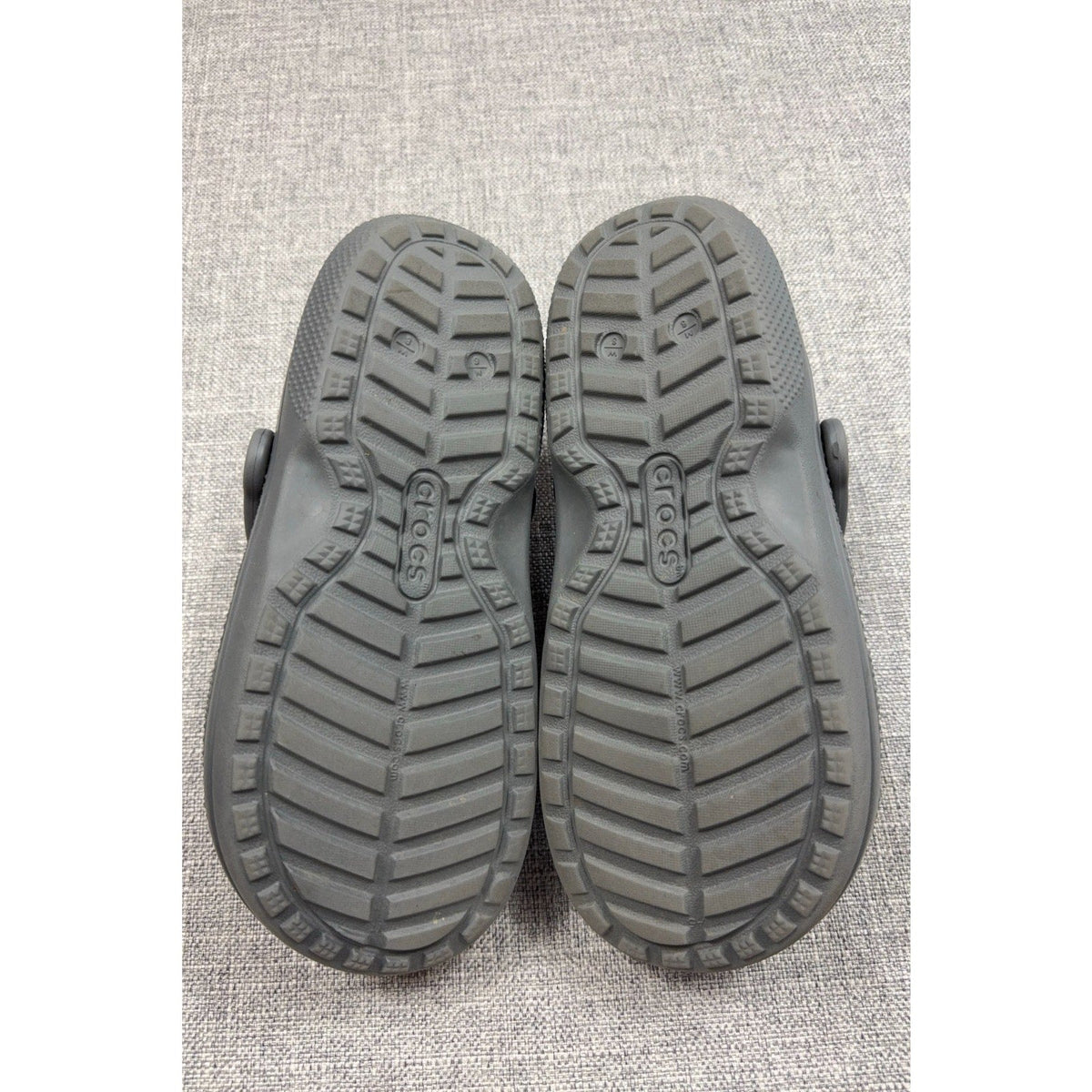 Gray Crocs Classic Lined Clogs outsoles showing tread pattern from Second Half Supply Co, LLC