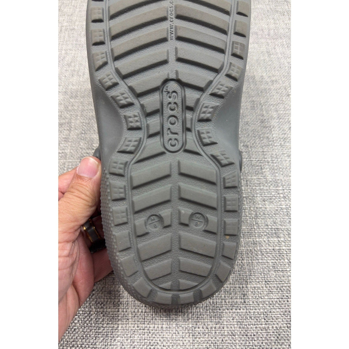 Second Half Supply Co, LLC gray Crocs Classic Lined Clog outsole showing tread pattern and size M6 W8 markings