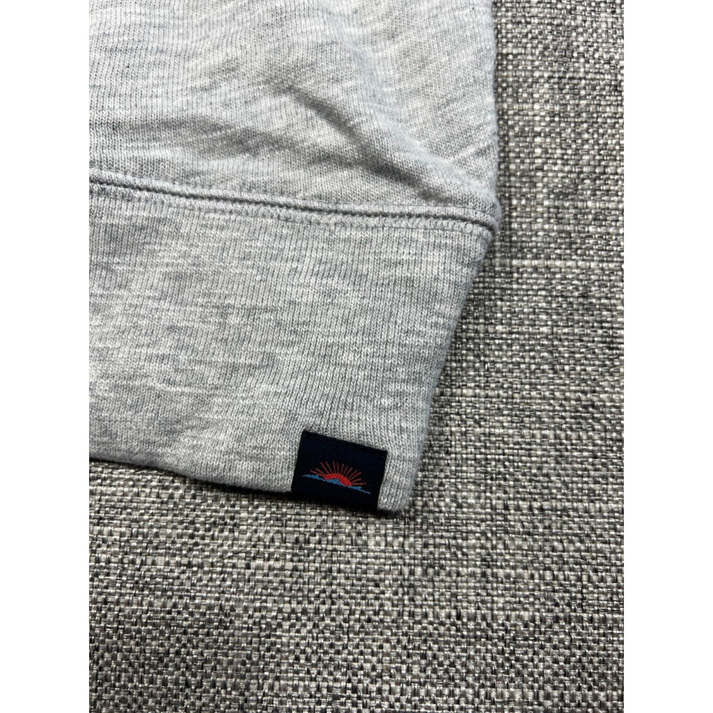 Second Half Supply Co, LLC gray organic cotton hoodie sleeve with ribbed cuff and small mountain sunrise logo patch