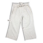 Second Half Supply Co, LLC gray linen blend wide leg cropped pants with a paperbag tie waist and front pleats.