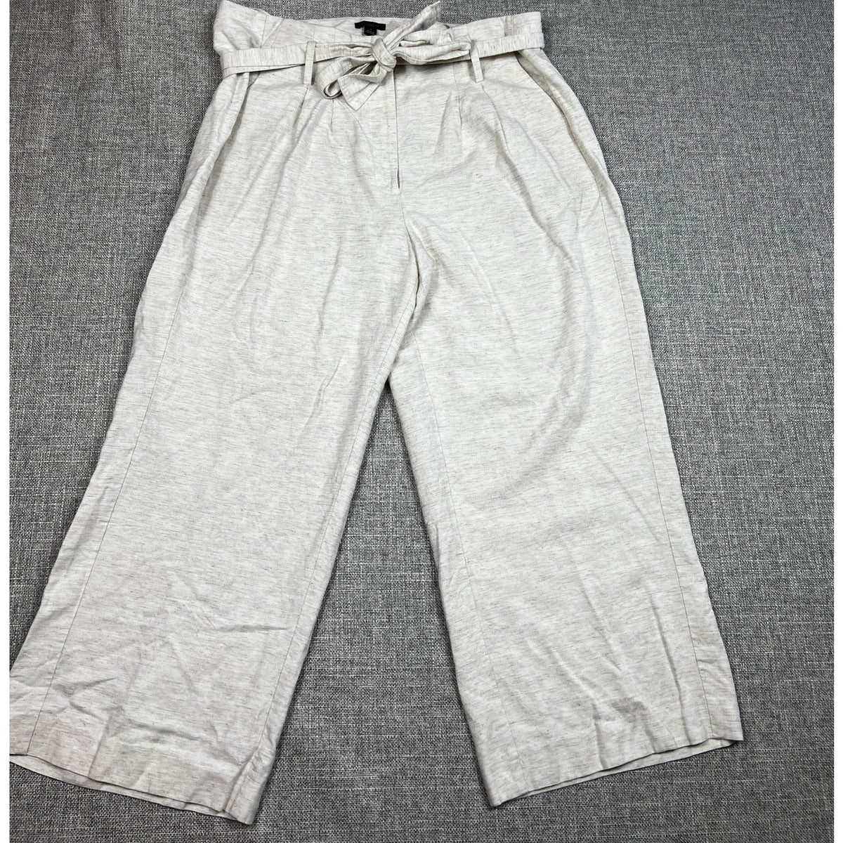 Second Half Supply Co, LLC gray heathered linen blend wide leg crop pants with a paperbag tie waist and front pleats.