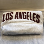 Second Half Supply Co, LLC heather gray H&M crewneck sweatshirt with maroon Los Angeles collegiate lettering