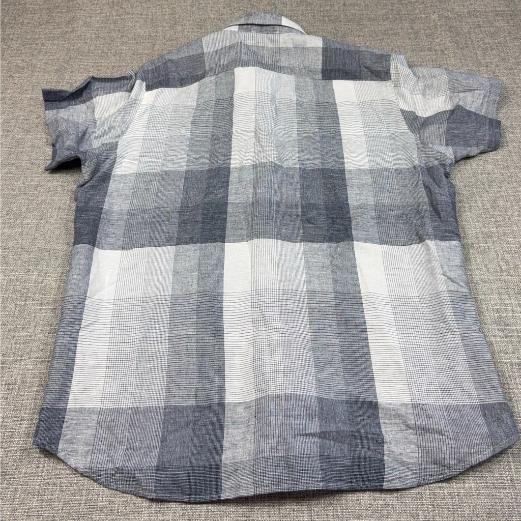 Second Half Supply Co, LLC men's gray and white plaid linen short sleeve shirt, back view with curved hem