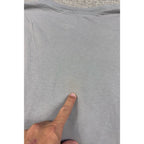 Second Half Supply Co, LLC gray Armani Exchange t-shirt showing a faint discoloration spot on the upper back fabric