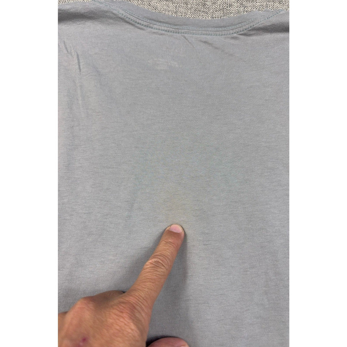 Second Half Supply Co, LLC gray Armani Exchange t-shirt showing a faint discoloration spot on the upper back fabric