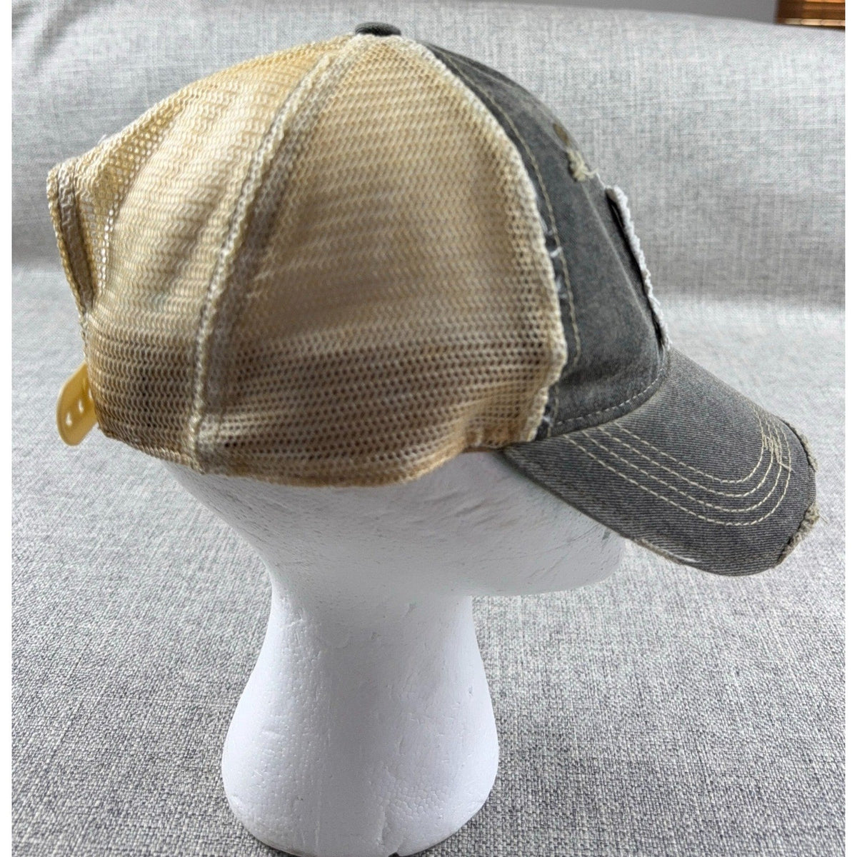 Second Half Supply Co, LLC gray and tan distressed mesh trucker hat with curved bill and adjustable snapback closure.