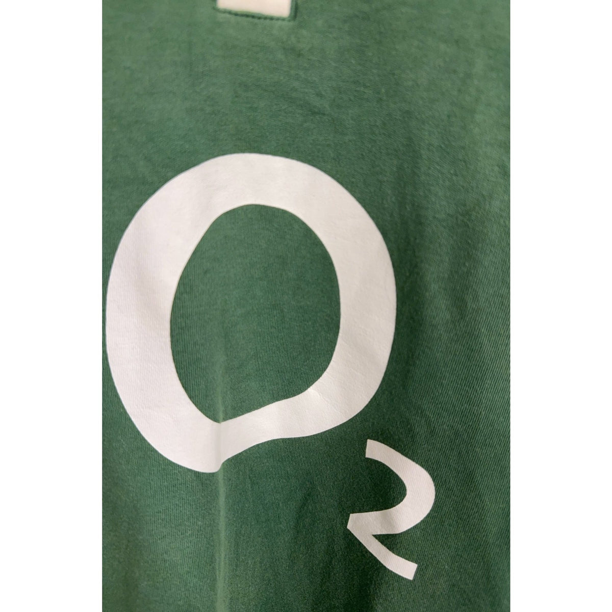 Second Half Supply Co, LLC green cotton rugby shirt featuring a white O2 sponsor logo on the chest