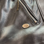 Second Half Supply Co, LLC vintage black leather Harley-Davidson motorcycle jacket with metal logo and zipper detail
