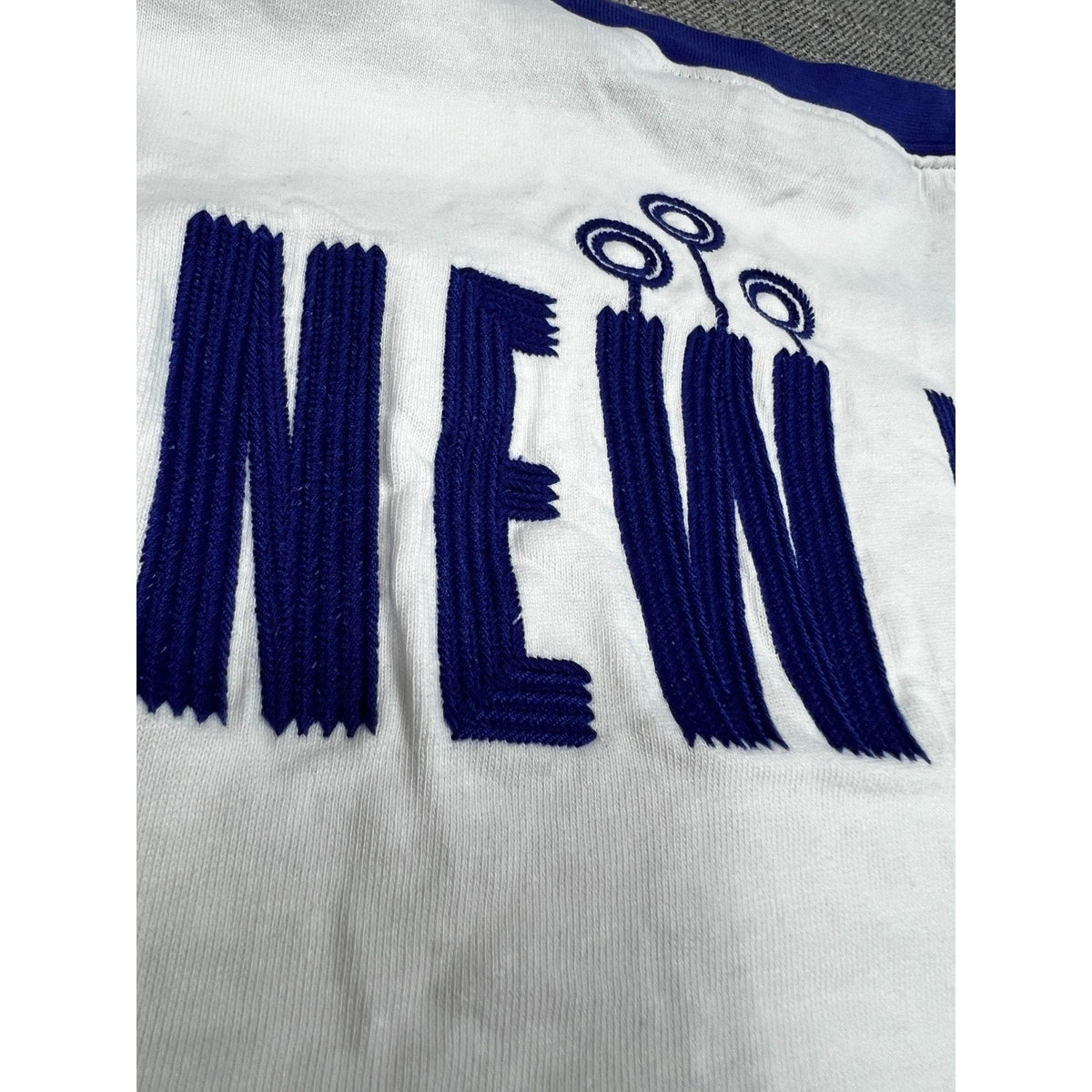 Second Half Supply Co, LLC Harry Potter Quidditch Supplies ringer tee featuring large blue embroidered New York text