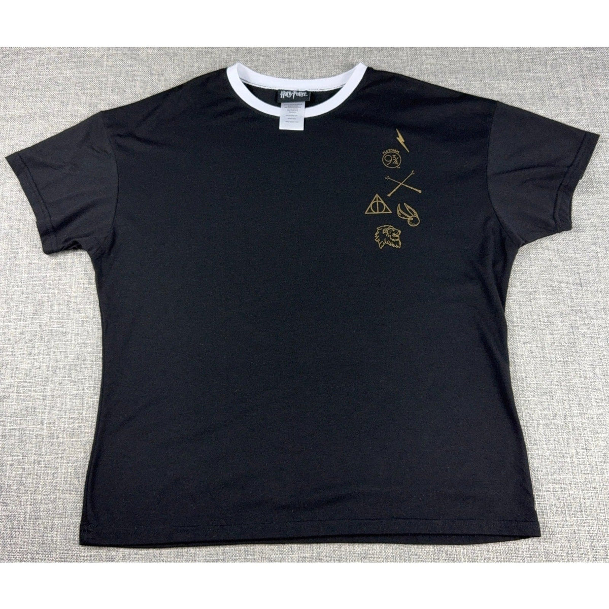 Second Half Supply Co, LLC black Harry Potter ringer tee with white collar and gold minimalist icon graphic print