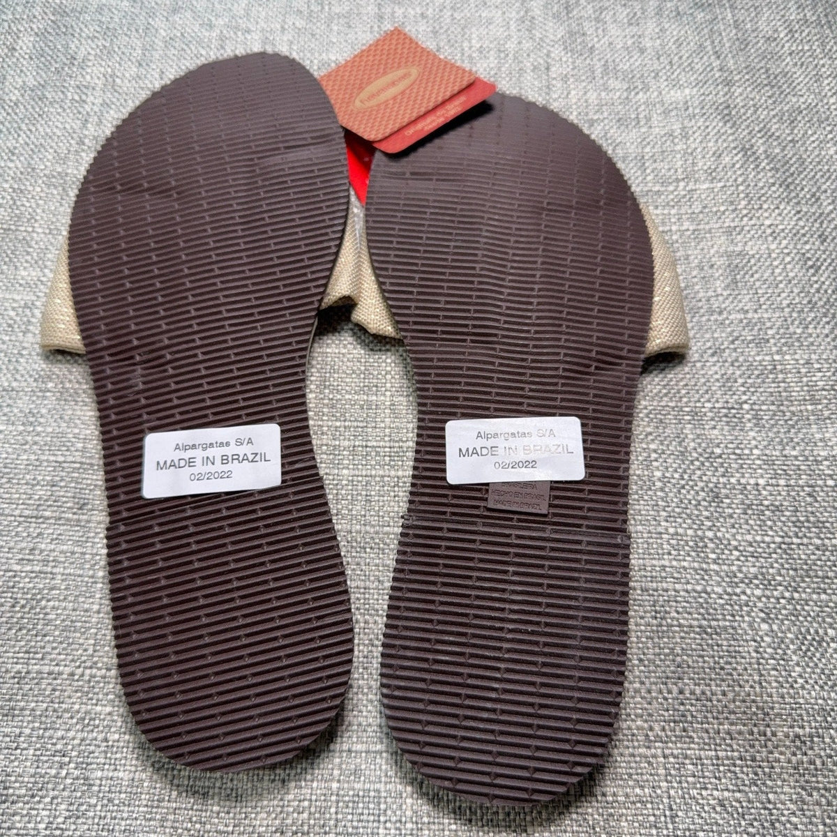 Second Half Supply Co, LLC Havaianas You St Tropez sandals showing the brown textured rubber outsoles and beige bows
