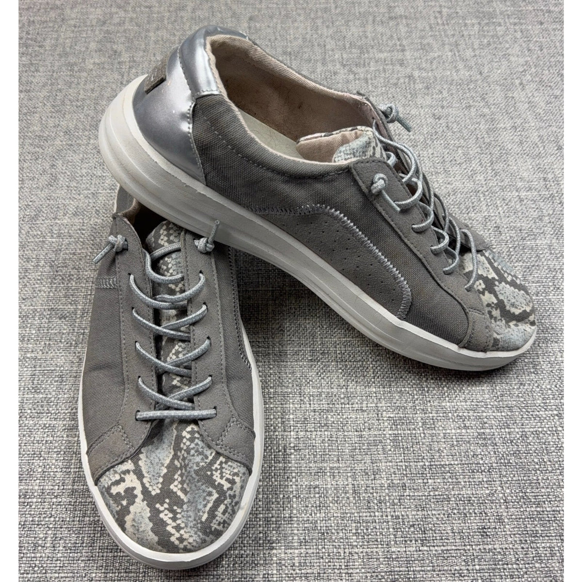 Second Half Supply Co, LLC Hey Dude Karina gray slip-on sneakers with metallic silver heels and snakeskin-print toes.