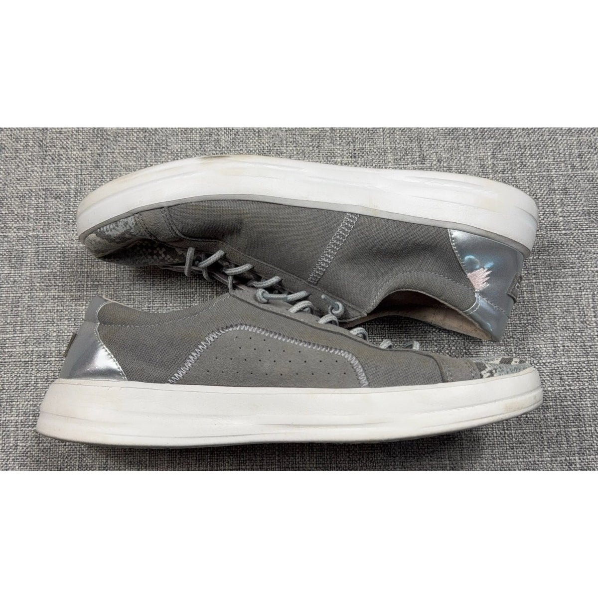 Second Half Supply Co, LLC Hey Dude Karina gray slip-on sneakers with metallic silver heels and snakeskin-print toes.