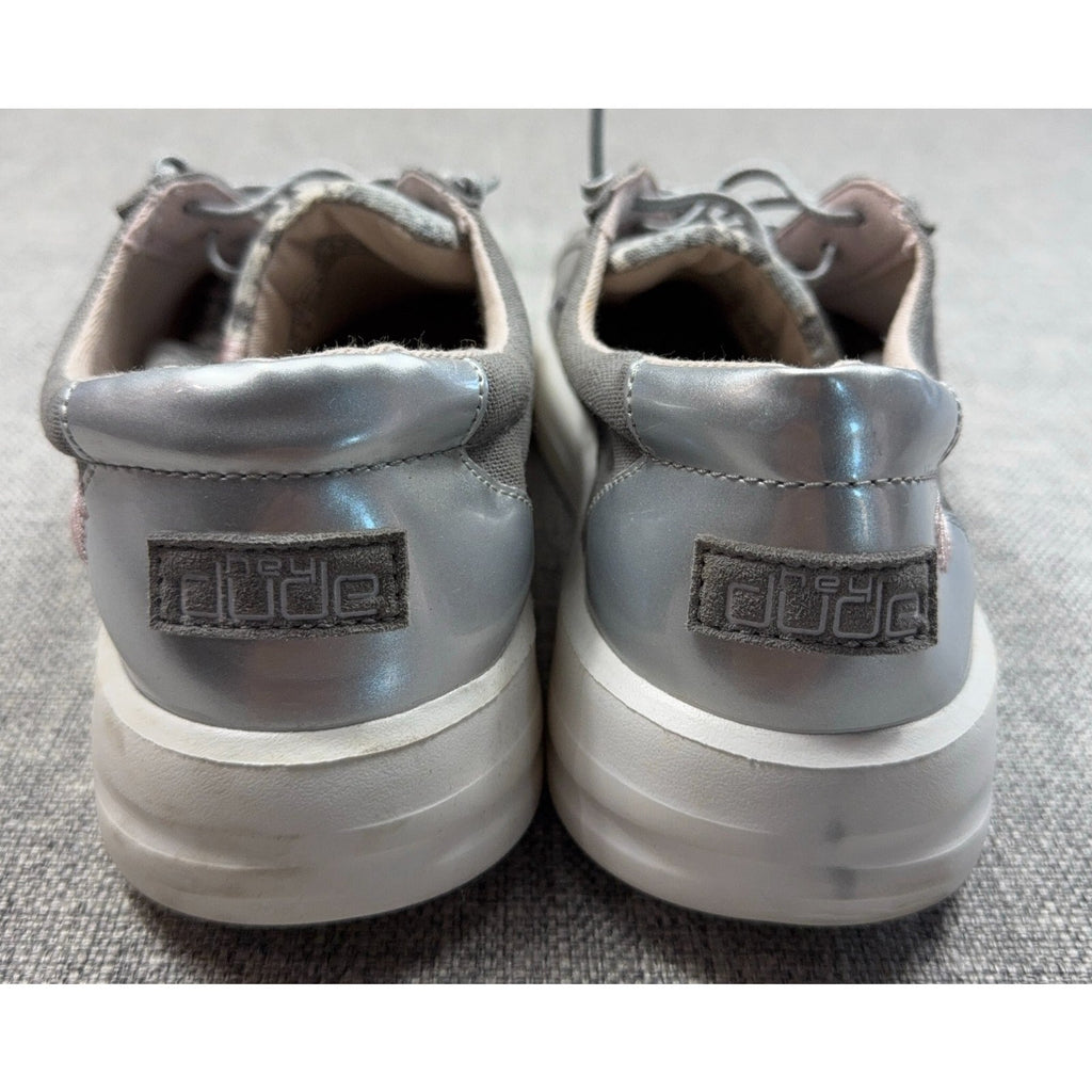 Second Half Supply Co, LLC Hey Dude Karina silver metallic slip-on sneakers with white soles, rear view
