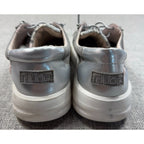 Second Half Supply Co, LLC Hey Dude Karina silver metallic slip-on sneakers with white soles, rear view