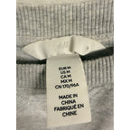 Second Half Supply Co, LLC H&M heather gray sweatshirt interior size tag showing medium fit and fabric details