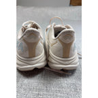 Second Half Supply Co, LLC HOKA Clifton 9 women's running shoes in shifting sand and eggnog, rear view of heels.