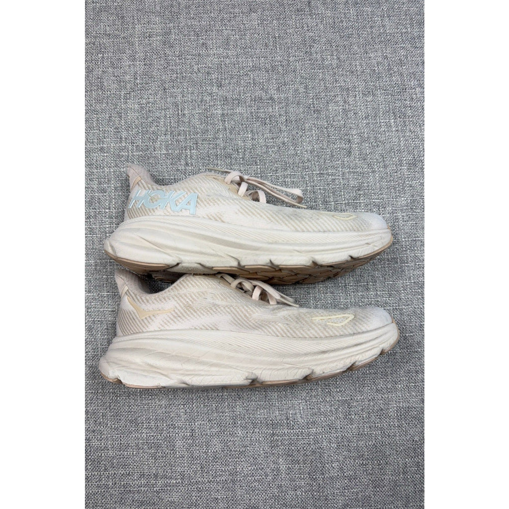 Second Half Supply Co, LLC HOKA Clifton 9 women's running shoes in shifting sand and eggnog with cushioned foam midsoles