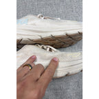 Second Half Supply Co, LLC HOKA Clifton 9 women's running shoes in shifting sand and eggnog with visible wear