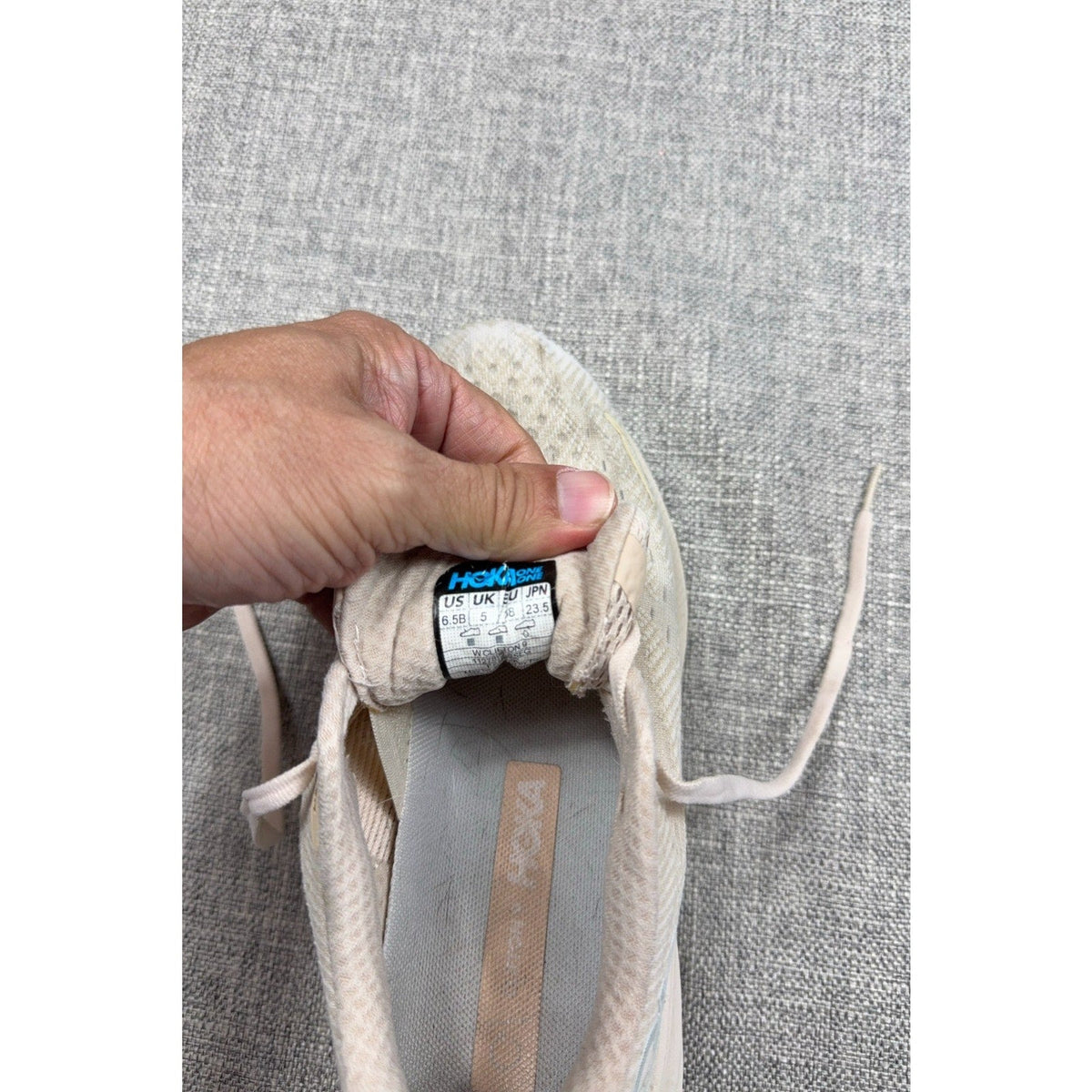 Second Half Supply Co, LLC HOKA Clifton 9 size 6.5B running shoe interior tongue label showing size and branding