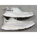 Second Half Supply Co, LLC white HOKA Clifton 9 running shoes with visible wear, discoloration, and scuffs on midsoles.
